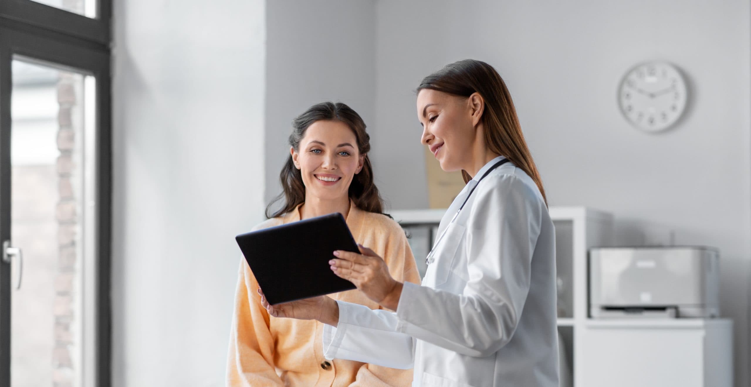 doctor-patient-tablet-consultation-indoors